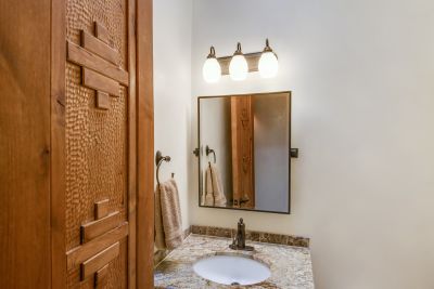 Powder Room with view of Hand Carved Doors Throughout Home