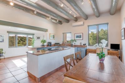 Bright cheerful granite kitchen with wraparound mountain views.