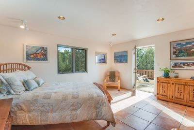 A deck in the woods, is right off the master bedroom, perfect for reading and bird watching!