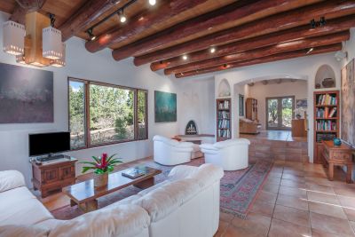 More Santa Fe Style elements: Kiva fireplace with hand sculpted chimney, bancos, and nichos