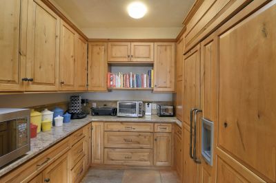 Pantry with storage and sub-zero refrigerator