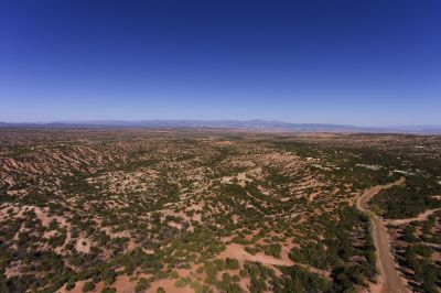 Aerial of Camino Sabio with North end of Jemez range in background