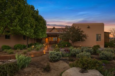 Landscaped Front Gardens and Flagstone Path to Front Entry at Sunset.