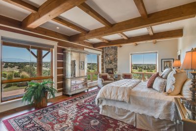 Master Bedroom - Handsome Cross-beamed Ceilings, Sitting Area Fireplace, 8' High Door & Banks of Windows,  Facing Fabulous Fairway, Lake, & Sangre de Cristo Mountain Views.