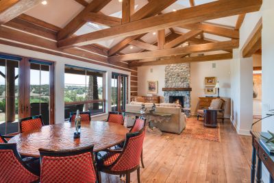 Great Room, Viewed  from the Generous Dining Area -  Planked Wood Floors, Banks of French Doors to Grand Portal, Sweeping Fairway & Sangre de Cristo Mountain Views.