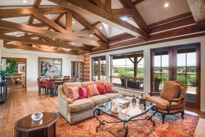 Great Room - Facing the Generous Dining Area and Family Room beyond; Banks of French Doors to Grand Portal; Sweeping Fairway & Sangre de Cristo Mountain Views.