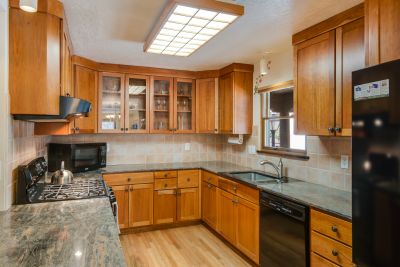 Updated Kitchen with Granite Counters and Cherry Cabinets