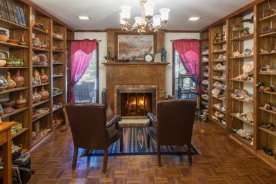 cozy wood library with a cherful fire!