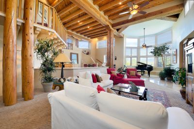 Lower level, dramatic, two story living room with mountain views