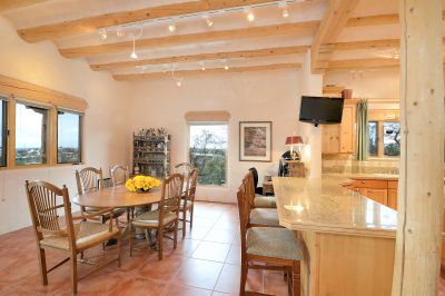 Casual dining, breakfast, lunch and simple dinners - right here by the family room and kitchen and looking out over the mountains!  Bright and cheerful, roomy and comfortable!