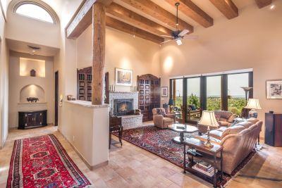 Galleria with 15' barrel vault ceiling opens to living room with French doors to Grand Portal & sweeping views.