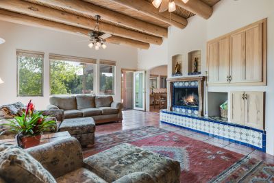 Great room has high ceilings with vigas & latillas, views!, and a fireplace