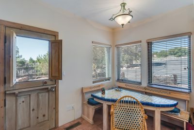 Breakfast nook in the kitchen with door to the outside.