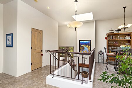 Stairs down to two bedrooms, two bathrooms and the Study/Den/TV/Library room