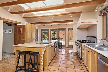 Main house kitchen with wood island and Viking range