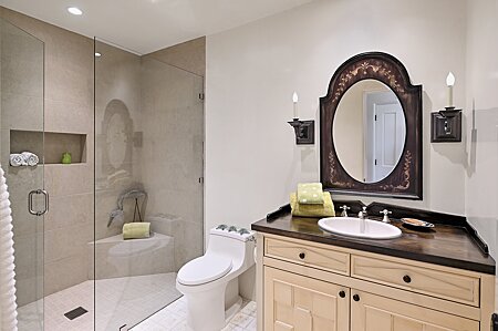 Bathroom Two, with spacious shower, Elegant Cabinetry & Sconces for illumination