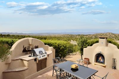 Outdoor grill and fireplace with far-reaching Jemez Mountain views to the West