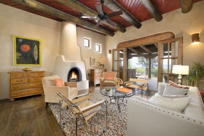 Living room with French doors leading to west portal, cantina and outdoor grill