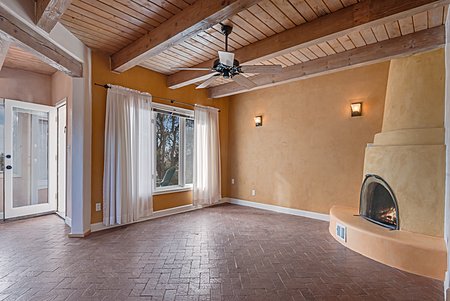 Stunning American Clay and Plaster Walls in Living and Dining Room with Beams in Ceiling 