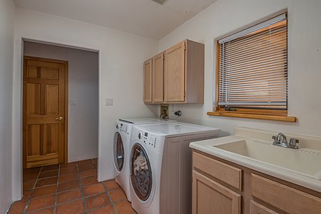 Large laundry room with sink