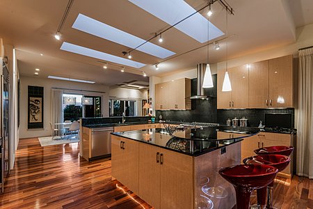 Natural light washes the home with many skylights