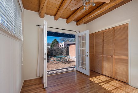 Guest Bedroom with french doors to backyard