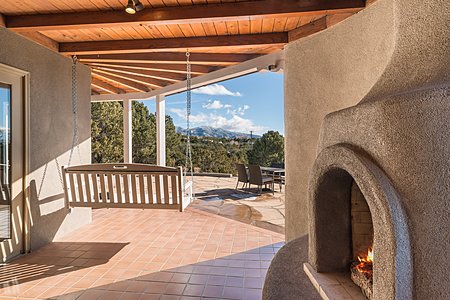 Side portal with kiva fireplace and fabulous view!