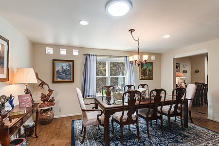 Separate dining room overlooking wooded greenbelt