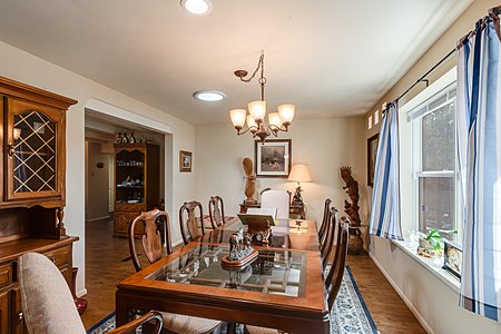 Spacious separate dining room with wooded views