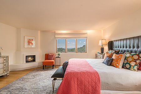 Master Bedroom with Woodburning Fireplace and Sunset Views