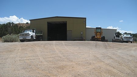 Equipment barn by the cattle pens and entrance