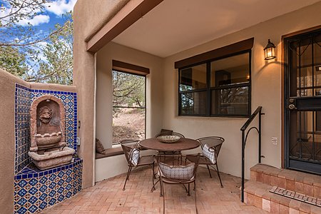 Delightful Protected Patio Dining Area with Banco & Raised Fountain with Beautiful Tilework