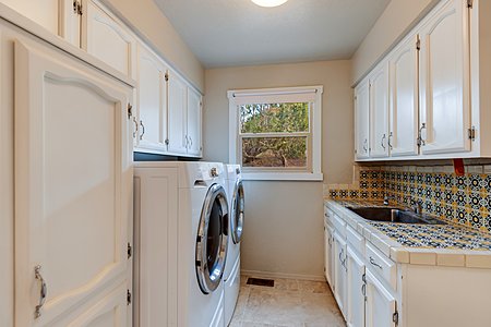 Laundry Room With Large Utility Sink, Tiled Counters & Back Splash, Excellent Storage, and 2018 Washer & Dryer