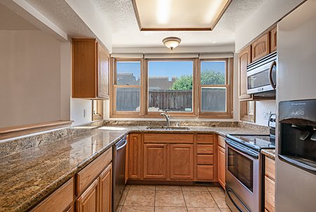 Updated Kitchen with Granite Counters and Stainless Steel Appliances