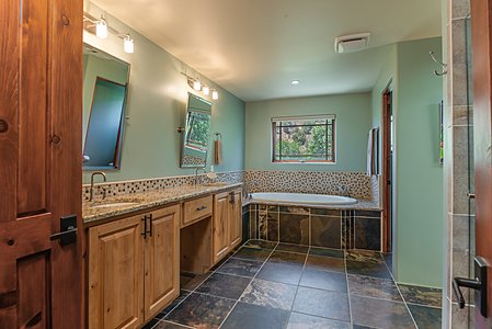 Glamorous master bath does include shower on right, and a spacious walk-in closet