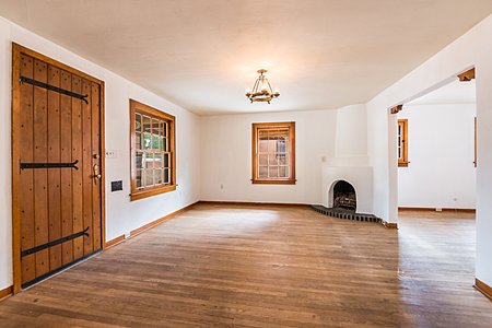 Living room with wood floors and Kiva fireplace