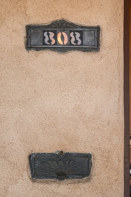 Detail view of mail slot and light up house numbers