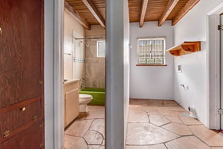 Split view of bathroom and laundry room
