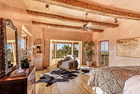 Master suite with artisanal kiva fireplace and views
