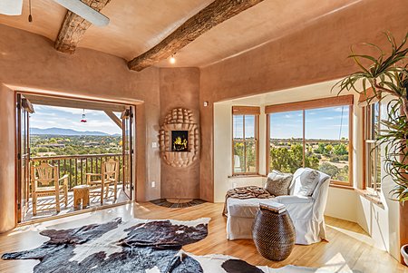 Master suite with artisanal kiva fireplace and private terrace