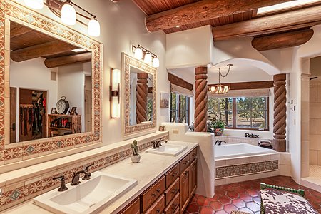 Owners' Bath with Separate Walk-in Shower and Door to Large Walk-in Closet
