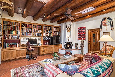 Private study with fantastic built-ins and continued tall ceilings