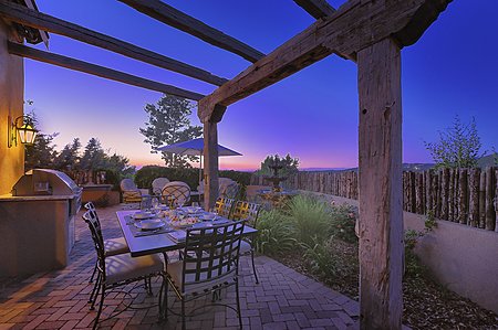 Outdoor dining area on patio at dusk