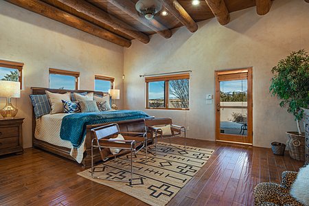 Spacious Master Bedroom with Sangre Mountain View & Door to Private Back Portal