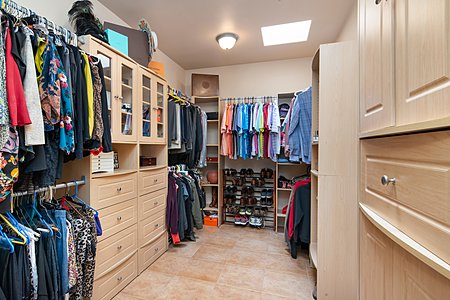 Spacious Master Closet with Two Skylights