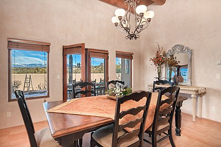 Spacious Dining Area with a Sangre Mountain View & Doors to the Back Portal