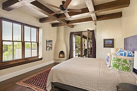 Master Bedroom with Kiva Fireplace and Views to the Jemez
