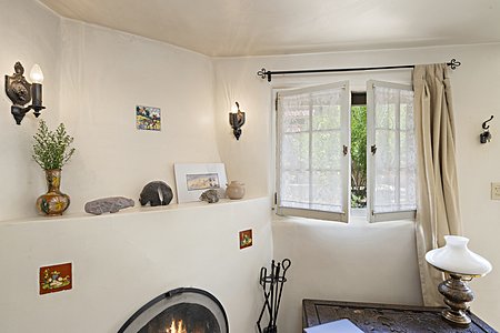 Corner Kiva Fireplace with traditional decorative tiles (in main living space)