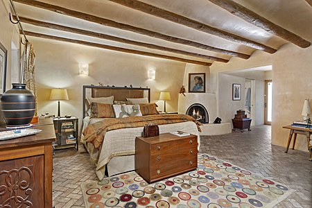 The Private Master Bedroom with Kiva Fireplace is a Calm Oasis