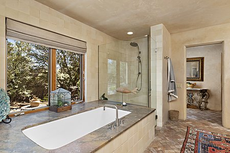 Master Bathroom Hydro Systems jetted Tub with wide stone decking + Shower